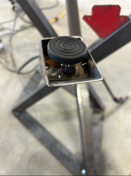 Levelling foot fitted inside the leg so the table sits flat on an uneven floor.