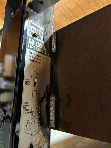 Close-up of the vertical fillet welds holding the weld-on trailer jack to the frame.