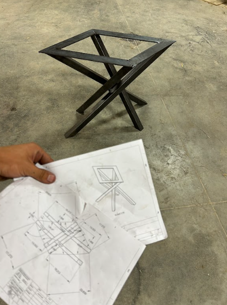 The fabricated base checked against the dimensioned shop drawings.