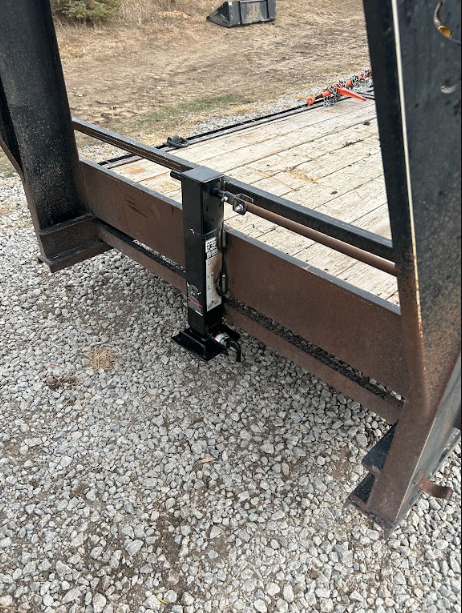 Drop-leg jack welded to the trailer frame and tested through its travel.