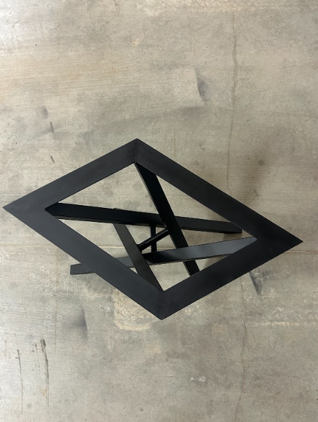 Looking down on the top frame and cross bracing of the coated table base.